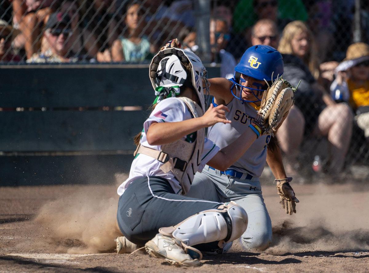 The Sutter Huskies’ Grace Diaz (9) is tagged out by Dixon Rams catcher Emily Morris (00) in the fourth inning as in the CIF Northern California Division III softball championship on Saturday.