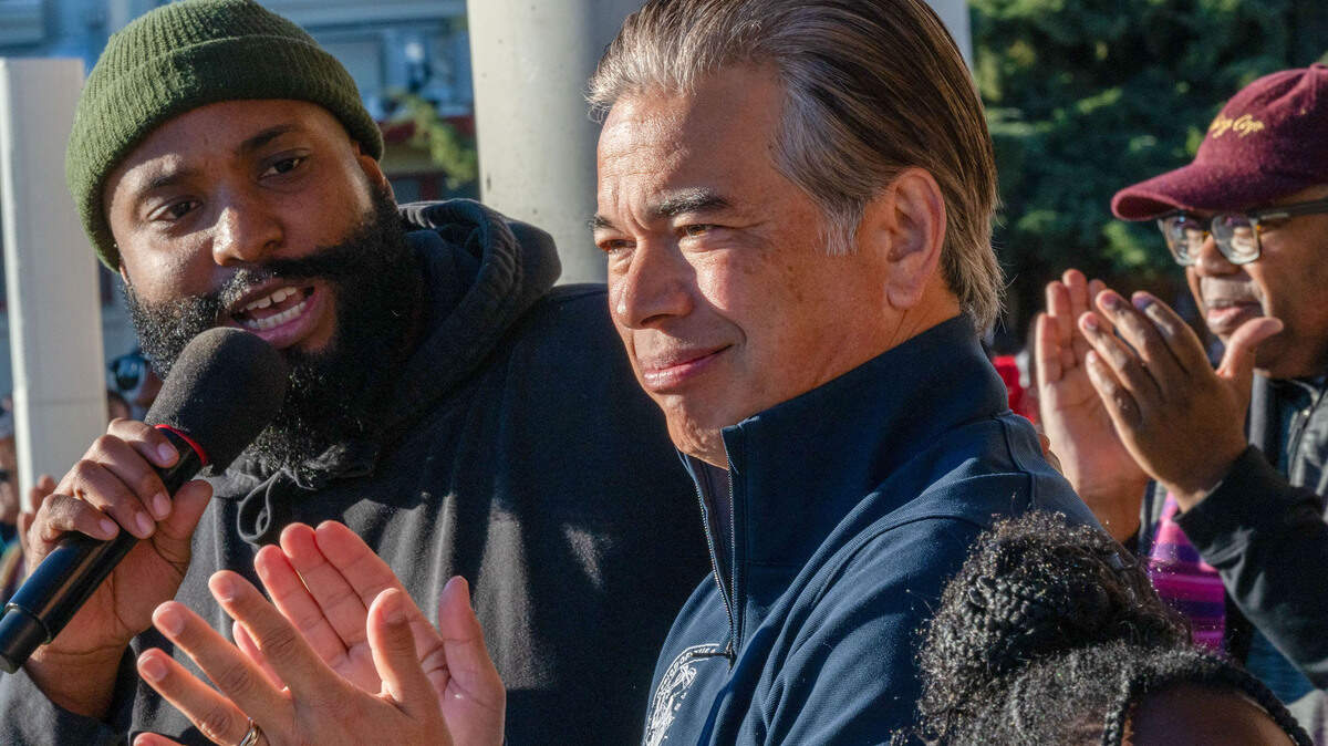 California Attorney General Rob Bonta applauds as Chinua Rhodes, left, a Sacramento City Unified School District board member, speaks at the March for the Dream honoring Martin Luther King Jr. at Sacramento City College on Monday, Jan. 20, 2025. Bonta led a multistate coalition of attorneys general in a December 2025 lawsuit challenging the Trump administration’s H-1B policy.