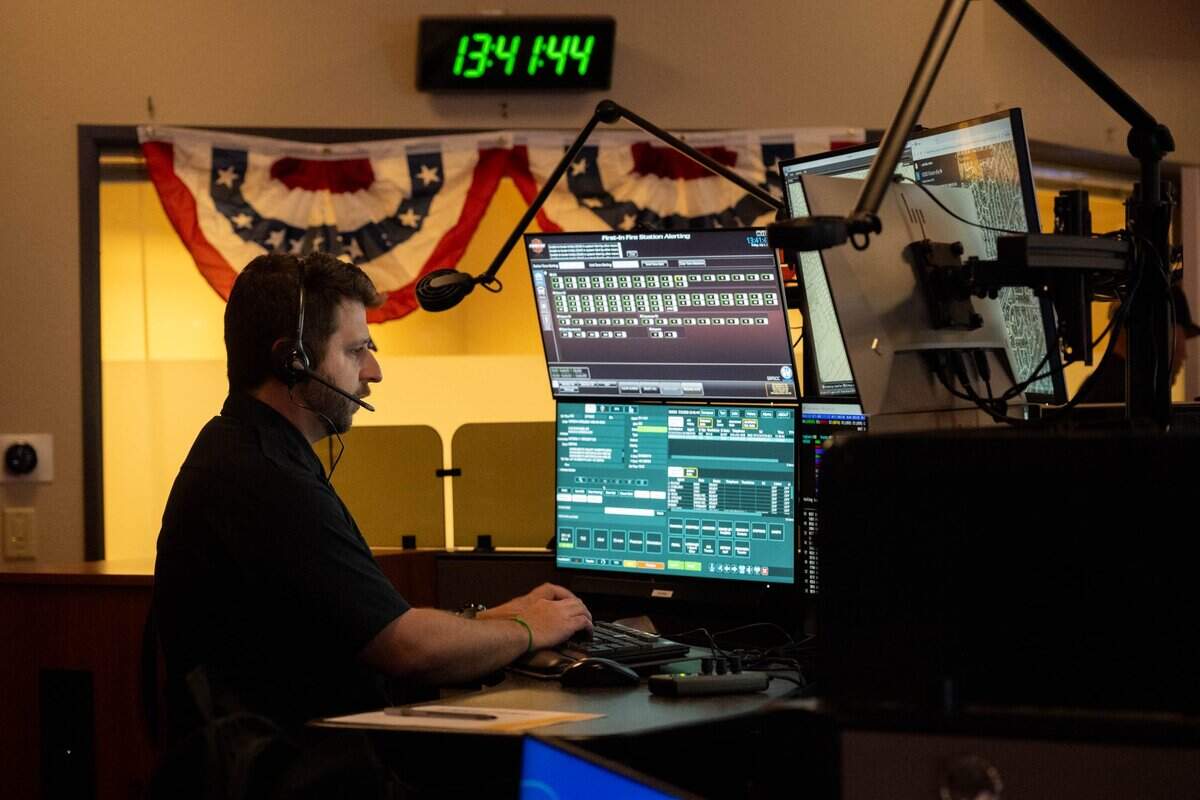 Dispatcher Nolan Saulter answers a 911 call at the Sacramento Regional Fire/EMS Communications Center on Friday in Rancho Cordova. Dispatchers are preparing for their busiest shift of the year as emergency calls surge during Fourth of July celebrations, with fireworks generating the largest share of fire and medical responses.