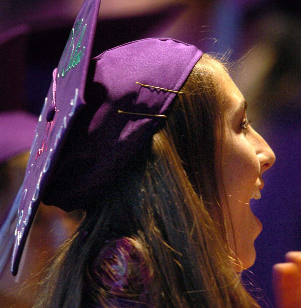 Tara O’Sullivan applauds during College Park High School’s commencement ceremony in Concord in 2011.
