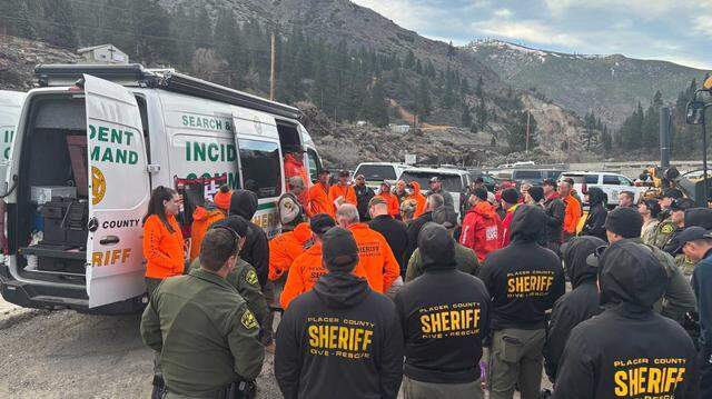 Search-and-rescue personnel from several agencies meet Monday morning near Floriston as they continued the search for a missing swimmer. The 19-year-old, who perished in the Truckee River, was recovered by divers and identified as a Petaluma man.