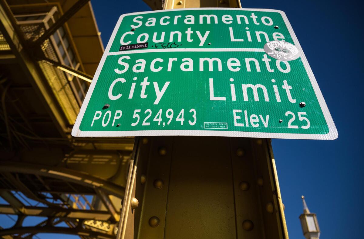 The Sacramento County and city limit signs, which display the city’s population and elevation, face eastbound traffic on Tower Bridge over the Sacramento River leaving West Sacramento earlier this month.