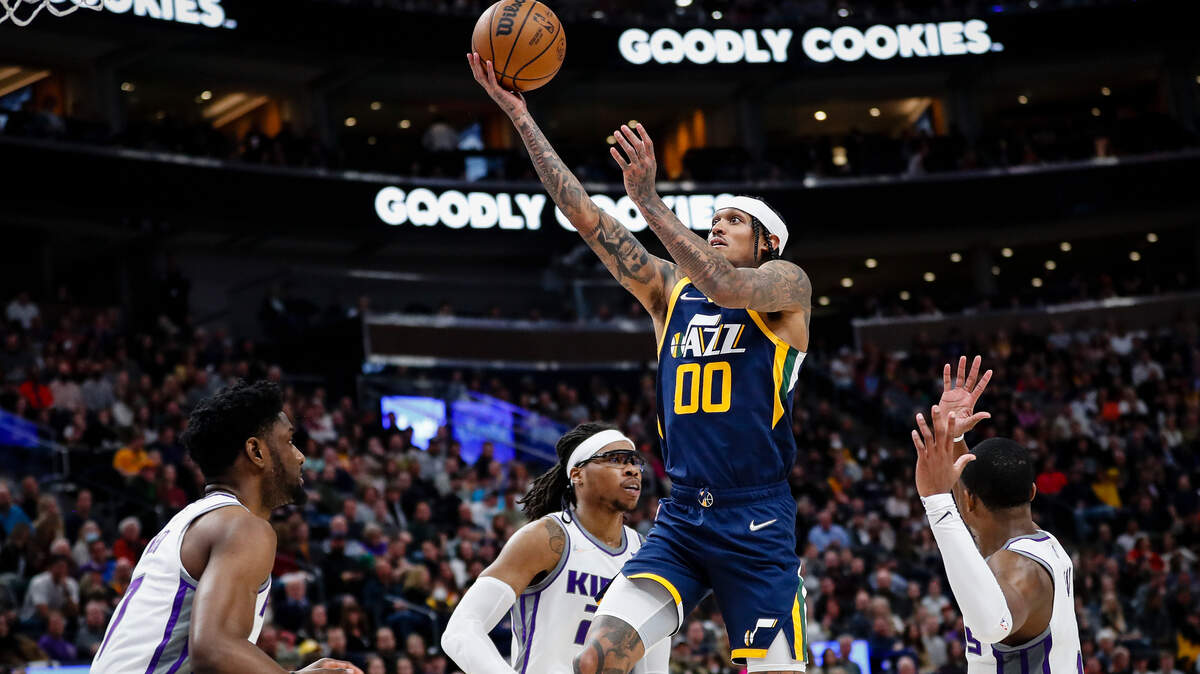 Utah Jazz guard Jordan Clarkson (00) goes to the basket between Sacramento Kings defenders during the second half of an NBA basketball game Saturday, March 12, 2022, in Salt Lake City. (AP Photo/Adam Fondren)