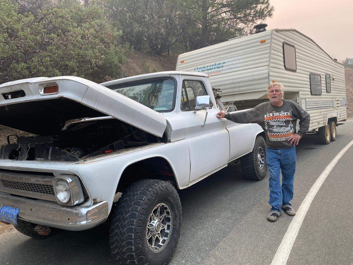 Pat O’Brien, who returned to Grizzly Flats to retrieve belongings but had his truck break down, waits for help.