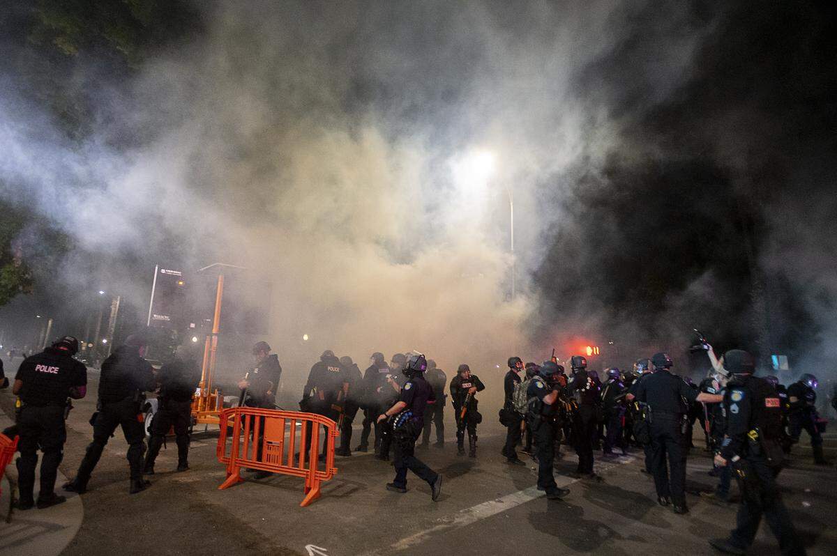 Sacramento Police fire tear gas to disperse demonstrators on 10th Street in Sacramento on Sunday, May 31, 2020, during a protest over the death of George Floyd who was murdered by Minneapolis police officers while being detained. His death prompted protests throughout the country.