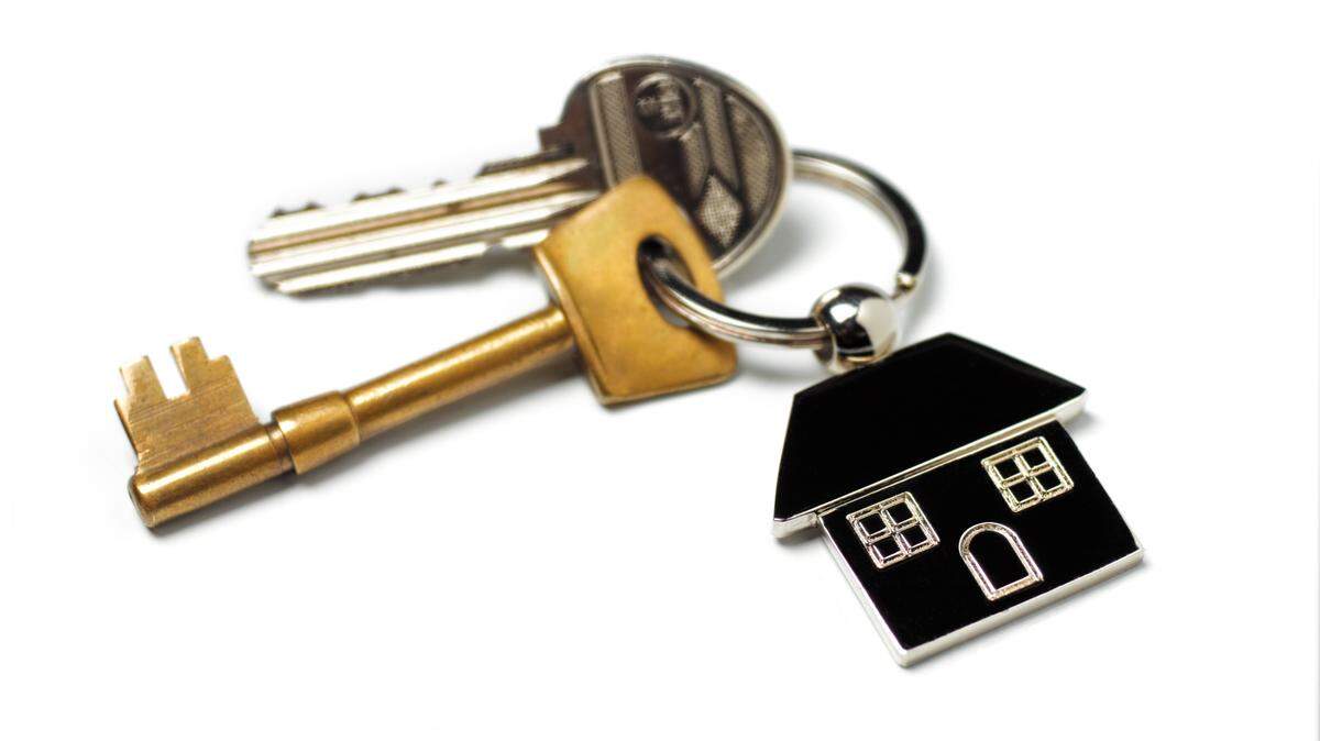 New house, house keys on white
