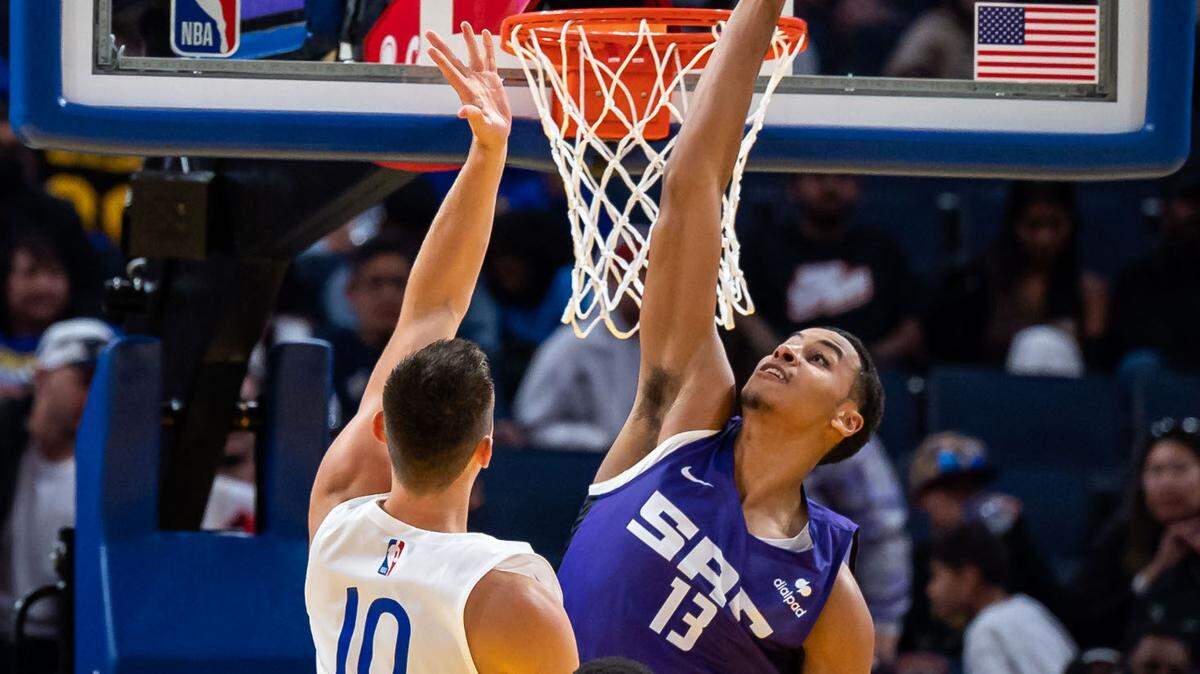 Sacramento Kings forward Keegan Murray (13), right, defends against Golden State Warriors guard Justinian Jessup (10) during the second half at the California Classic NBA preseason basketball game in July at Chase Center in San Francisco.