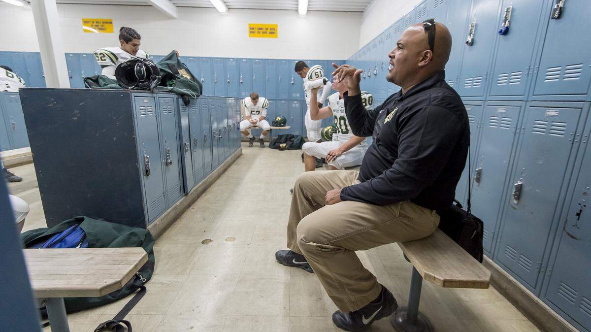 Monterey Trail Mustangs coach T.J. Ewing talks to his linemen before a game in 2016.