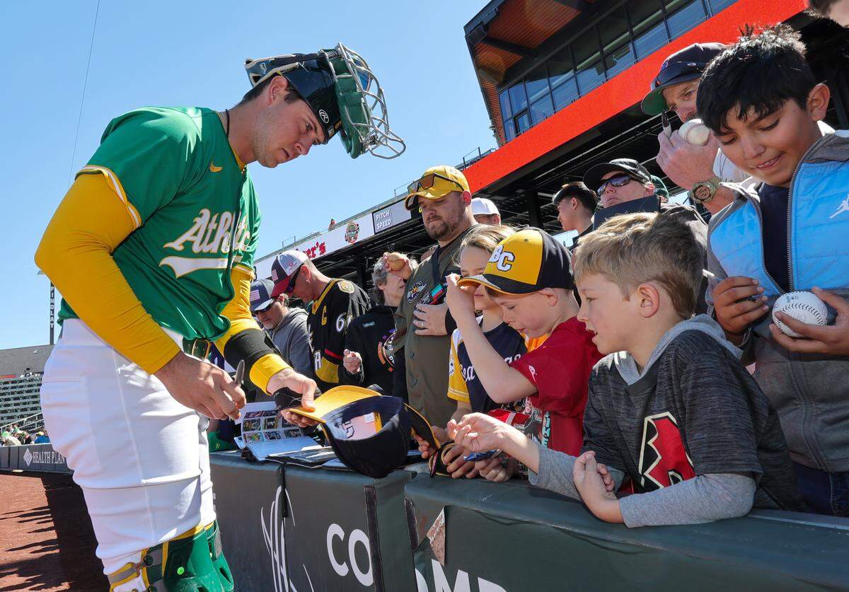 Daniel Susac of the Athletics signs autographs for fans before a spring training game against the Arizona Diamondbacks at Las Vegas Ballpark on March 9, 2025, in Las Vegas, Nevada. Susac was drafted in 2022 by the Athletics and will start the 2026 season on the San Francisco Giants 26-man roster.