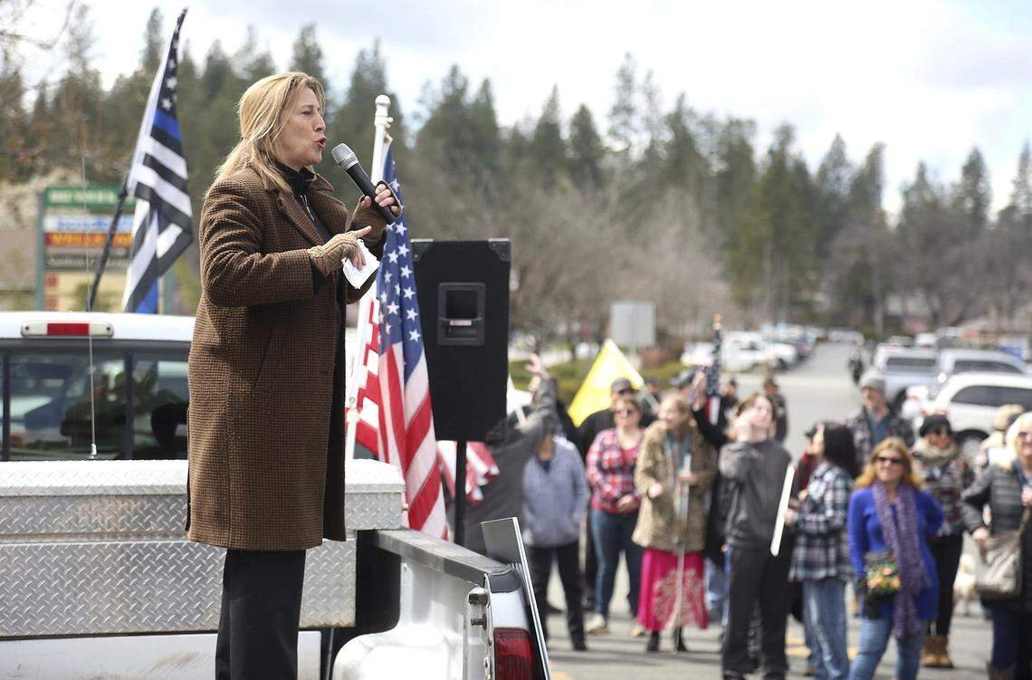 Former Nevada City Mayor Reinette Senum denounces the local media, the COVID-19 vaccine, and governmental authority as she talks to a large crowd gathered for a “Worldwide Rally for Freedom” in a Bank of America parking lot in Grass Valley in March. Senum stepped down from her position after denouncing the use of face masks.