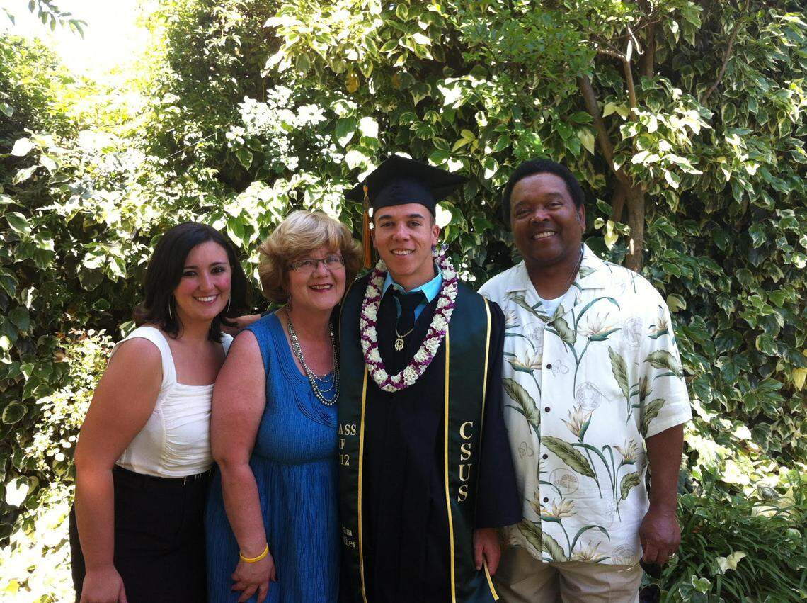Sarah Gaither, left, an assistant professor at Duke University’s Identity and Diversity Lab, poses for a family picture with her mother Kathy Gaither, brother Adam Gaither and father Clifford Gaither in Sacramento after Adam’s graduation from Sacramento State in 2012.