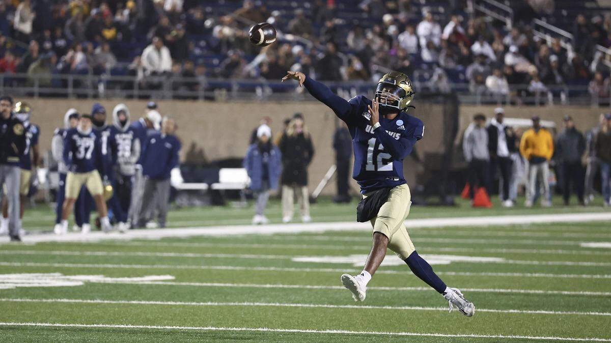 UC Davis Aggies quarterback Caden Pinnick (12) throws the ball in the first quarter of a second-round NCAA Division FCS playoff game against the Rhode Island Rams at UC Davis Health Stadium on Saturday, Dec. 6, 2025. His team plays in the FCS quarterfinals Saturday, Dec. 13, 2025.