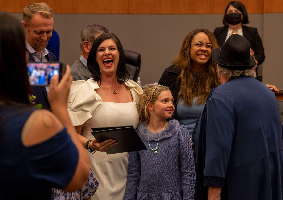 Lisa Kaplan laughs with friends and family as photos are taken following her swearing in ceremony Tuesday at the Sacramento City Council chambers.