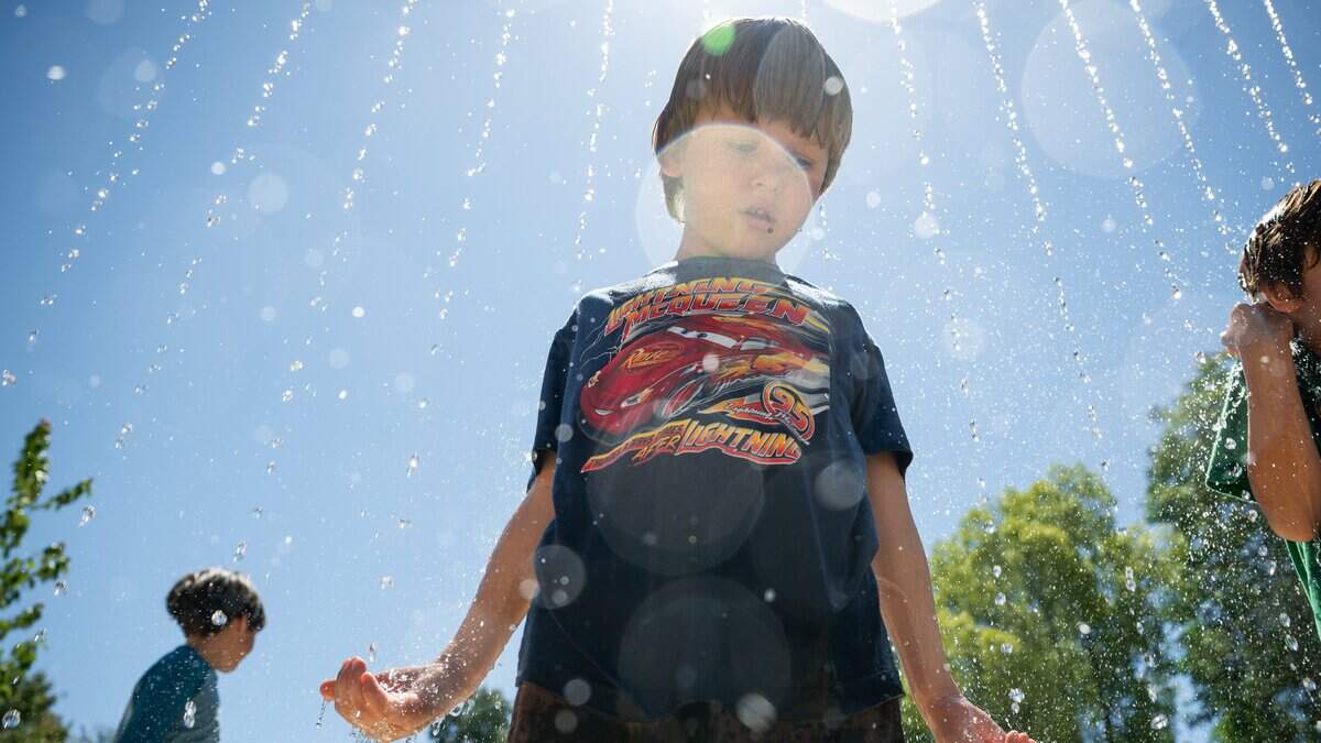 James Panko, 5, checks out the new splash pad at Westacre Park in West Sacramento on July 9. 