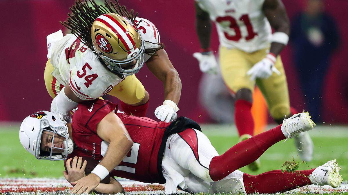 MEXICO CITY, MEXICO - NOVEMBER 21: Fred Warner #54 of the San Francisco 49ers tackles Colt McCoy #12 of the Arizona Cardinals during the first half at Estadio Azteca on November 21, 2022 in Mexico City, Mexico. (Photo by Sean M. Haffey/Getty Images)