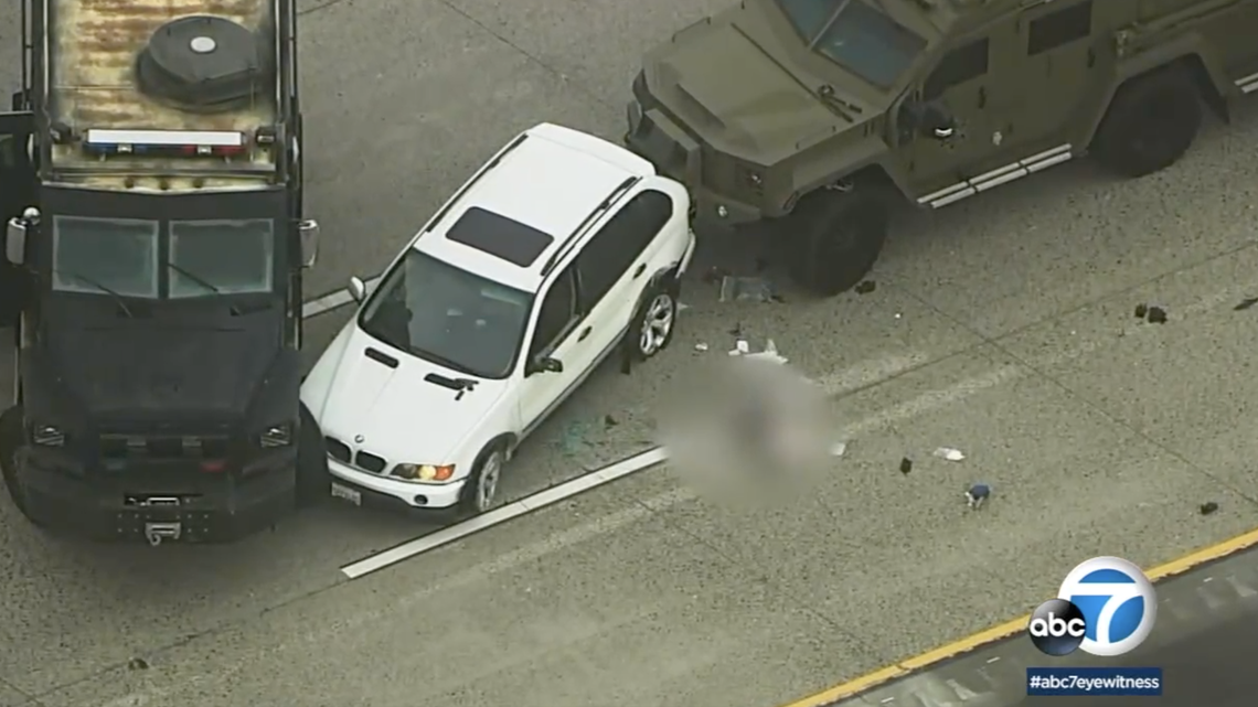 San Diego police say a naked woman said her boyfriend assaulted her and they pursued a man on Interstate 5 near Camp Pendleton. He shot himself, cops said.