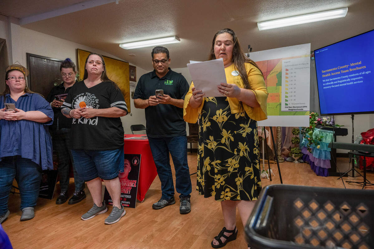 Crystal Sanchez, left, president of the Sacramento Homeless Union, announces the opening of The Stoop Cooperative resource hub for the unhoused on Del Paso Boulevard in Sacramento on Monday. “It’s time for real solutions — not Band-Aids on a bleed-out situation when what we need is the tourniquet,” she said.