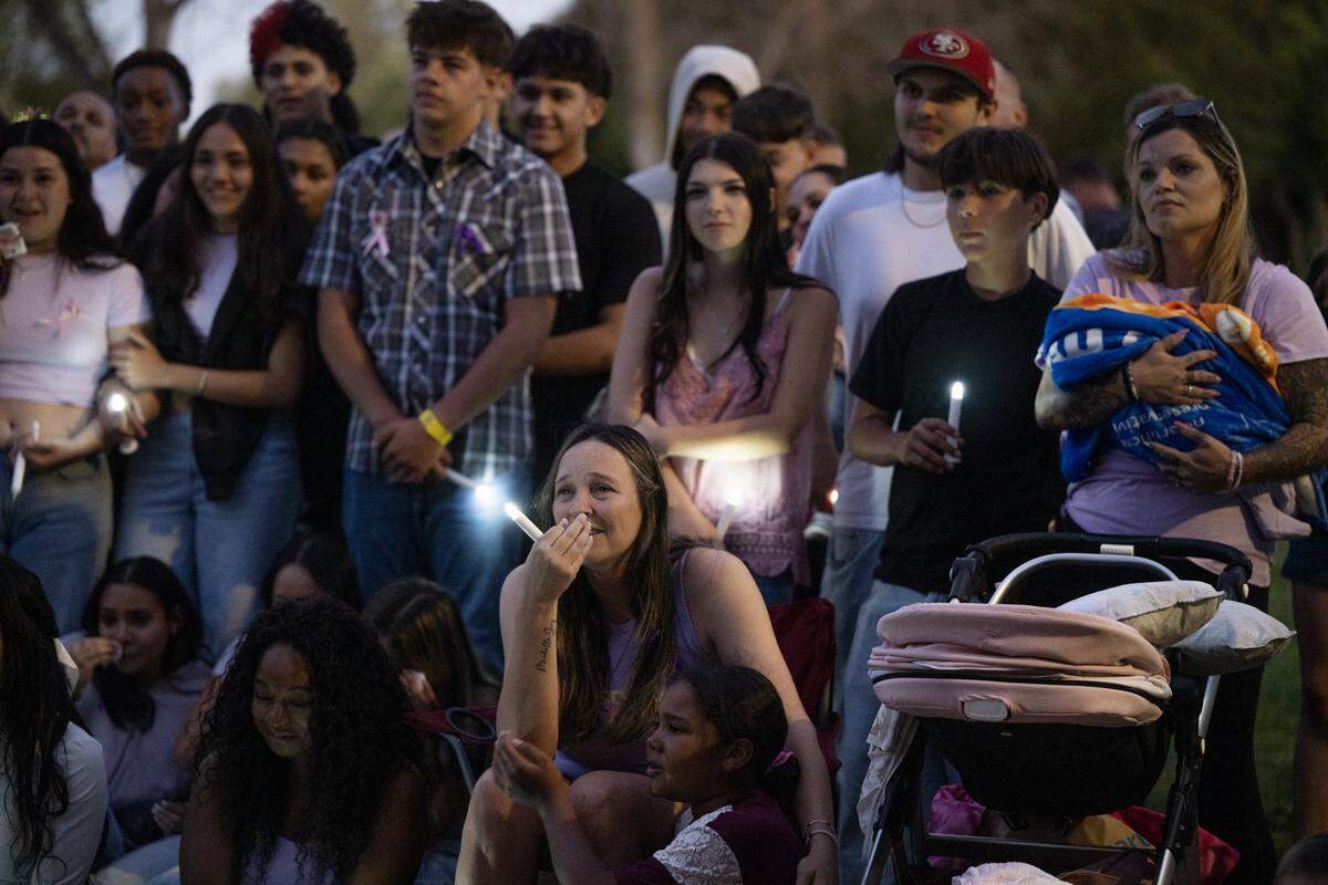 Mourners of Ariyonna Orozco, 16, and Piper Conkling, 14, who died in the fiery crash near Rancho Murieta, grieve at a candlelight vigil at North Laguna Creek Park in Sacramento on Friday.