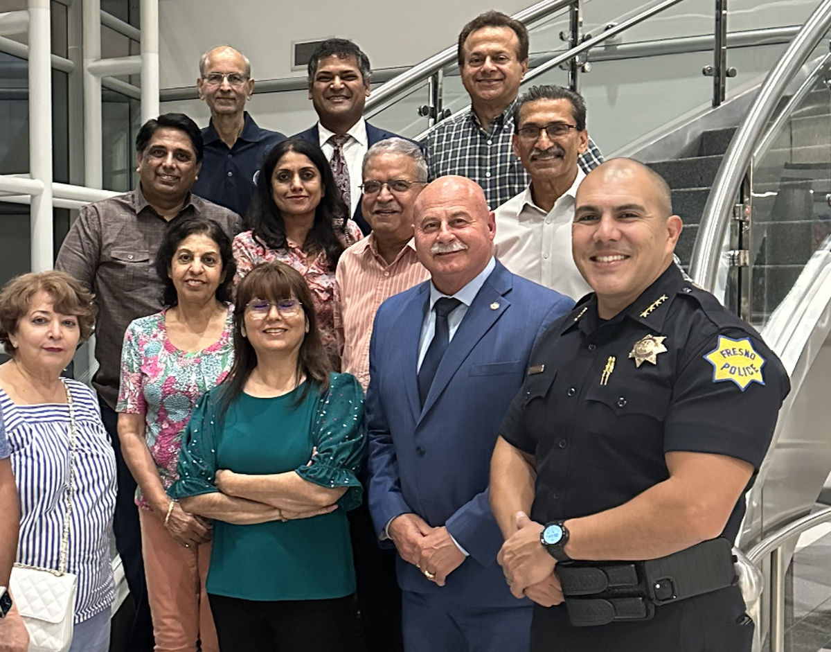 Following an October 2023 meeting with Fresno Mayor Jerry Dyer (second from right lower row) and former Fresno Police Chief Paco Ballerama (far right lower row), meeting participants who allegedly said a local elected official of Sikh descent was linked to terrorism, pose for a photo in Fresno City Hall.