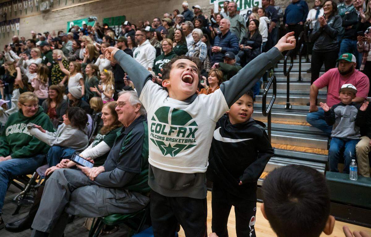 Colfax Falcons head coach Rexanne Simpton’s 8-year-old son and other children celebrate the team’s performance against the Caruthers (Fresno County) Blue Raiders during the fourth quarter at the CIF Northern California Division III high school girls basketball championship game Tuesday, March 7, 2023, at Colfax High School. Colfax beat Caruthers, 53-52, and advances to the state championship game Friday at Golden 1 Center.