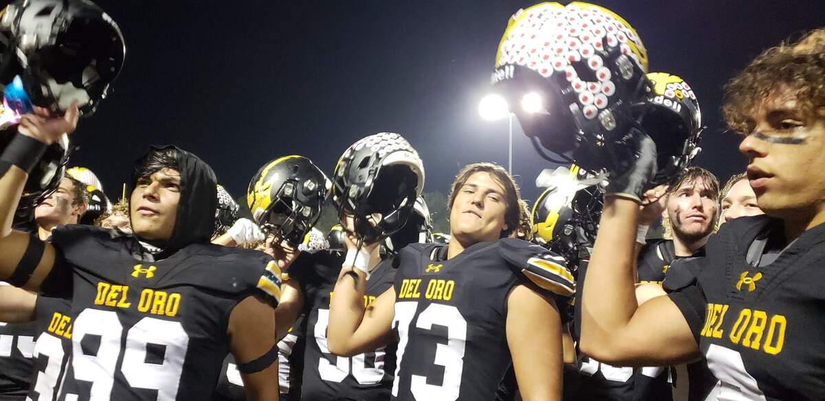 The Del Oro High School football team celebrates with its fight song following a 37-23 victory over Laguna Creek in the first round of the CIF Sac-Joaquin Section playoffs on Friday, Nov. 3, 2023, in Loomis.