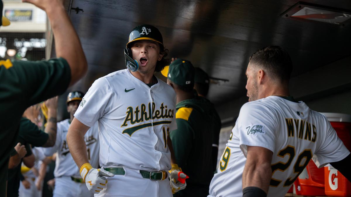 Athletics first baseman Nick Kurtz celebrates with teammate Austin Wynns (29) after clearing the bases with a grand slam homer off Atlanta Braves pitcher Jesse Chavez in the bottom of the second inning on July 8 at Sutter Health Park in West Sacramento. 
