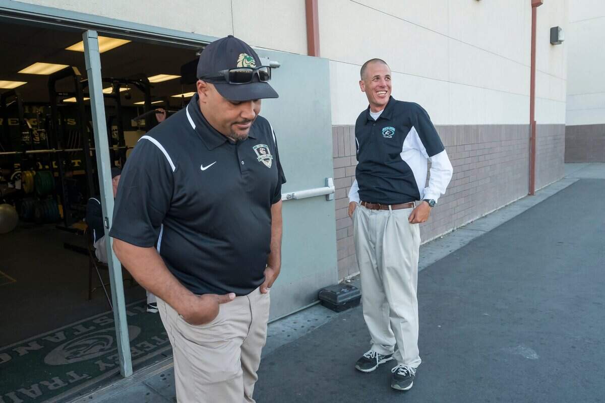 Monterey Trail Mustangs coach T.J. Ewing talks with then-Sheldon coach Joe Cattolico before the Mustangs beat the Huskies in 2016. Ewing and Cattolico, now coaching at Granite Bay, face off again Friday.