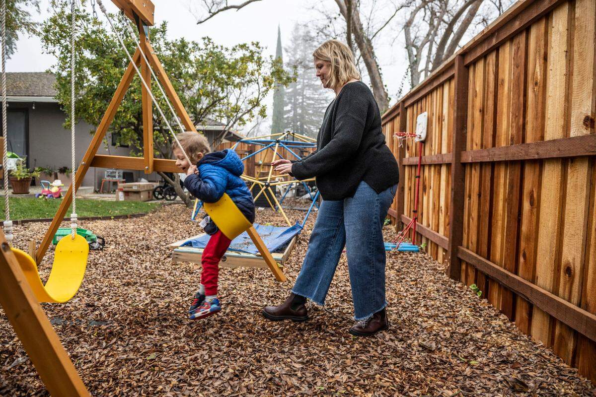 Elizabeth Olson plays with her four-year-old son Lucas in their back yard earlier this month. She wants to build an additional unit on the property, encouraged by SB 9, but has not been able to afford the construction costs. “Financially, it just doesn’t pencil out right now,” she said.
