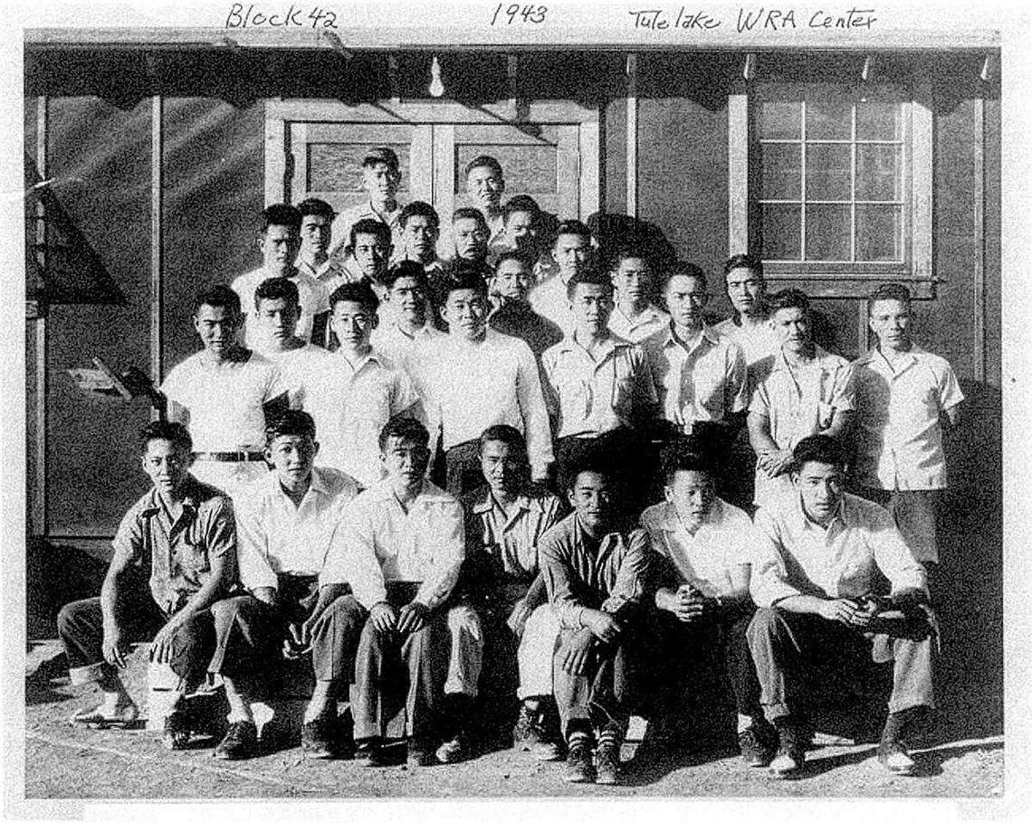 Japanese American men stand on the steps of a mess hall at the Tule Lake internment camp in Siskiyou County in 1943, including Jim Tanimoto, second from right in the front row. The men became known as the Block 42 resisters after refusing to answer two questions on a government loyalty questionnaire, leading to their transfer to a separate facility at Tule Lake.