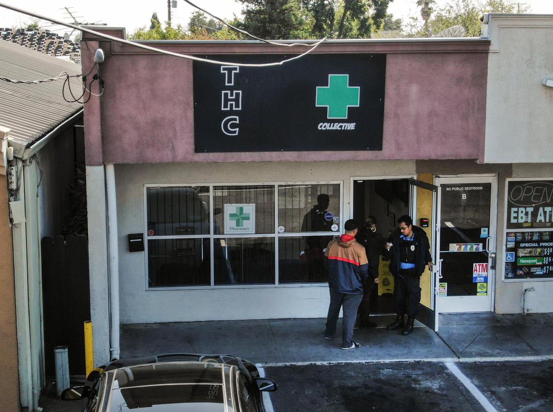 A security guard checks the ID of a potential customer at THC, a retail pot dispensary on Fruitridge Road in south Sacramento, on Sunday, Oct. 13, 2019. Andrey Kukushkin, who was indicted last week along with two associates of Rudy Giuliani in a scheme to funnel foreign campaign donations to U.S. politicans, is one of two permit holders for the dispensary, and is listed as the chief financial officer of the corporation which operates it.