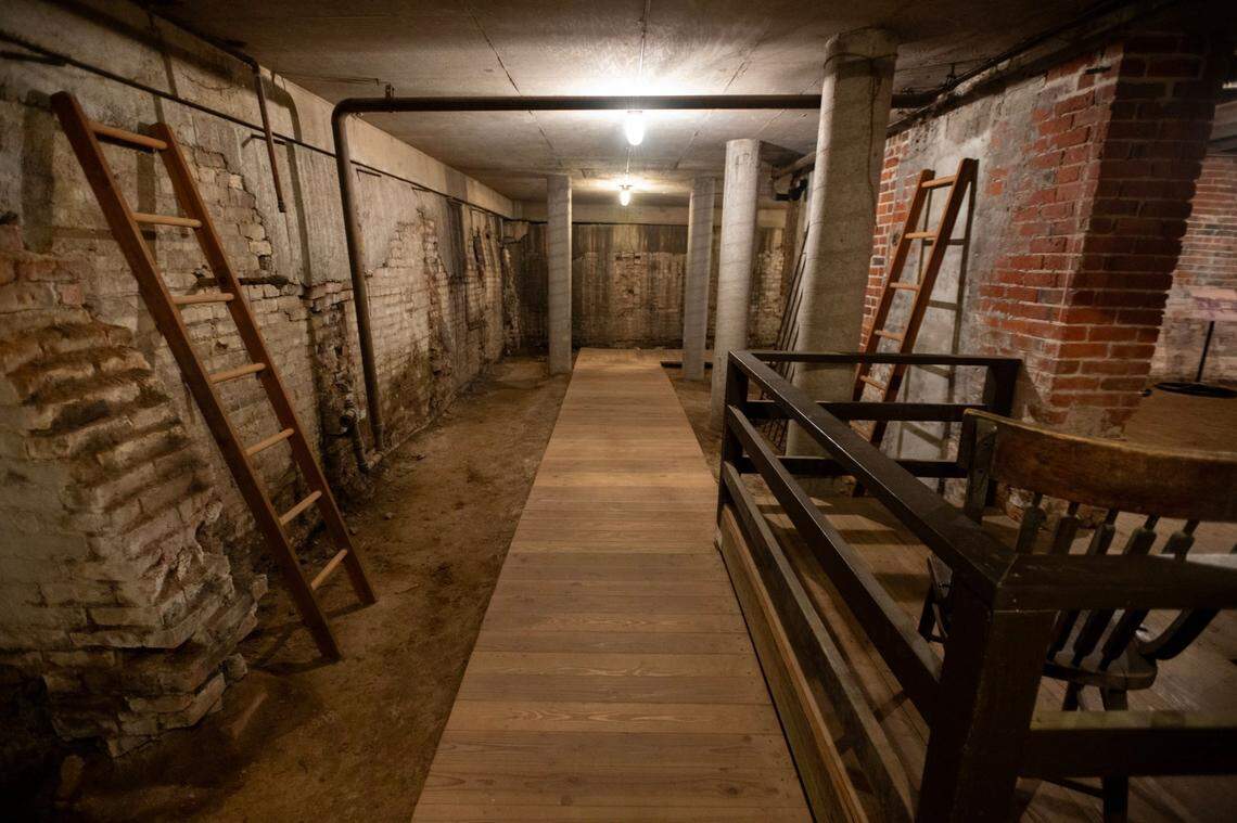 A retaining wall, at left, built in the 1800s holds back the elevated street next to the B.F. Hastings building, part of the Old Sacramento Underground Tour, on Aug. 23, 2024. The streets of the were raised as much as 15 feet because of frequent flooding.