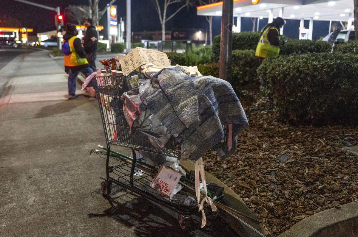 A shopping cart holding the belongings of a homeless person is parked on the sidewalk near Watt Avenue during the Sacramento County Point-in-Time homeless count on Monday. The survey is conducted every two years in an attempt to measure the number and demographics of the county's homeless population. 