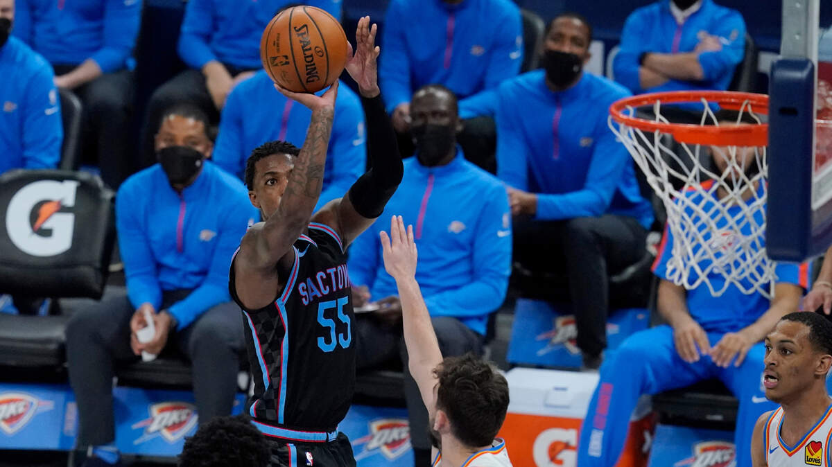 Sacramento Kings guard Delon Wright (55) shoots over Oklahoma City Thunder guard Ty Jerome, center, in the second half of an NBA basketball game Tuesday, May 4, 2021, in Oklahoma City. (AP Photo/Sue Ogrocki)