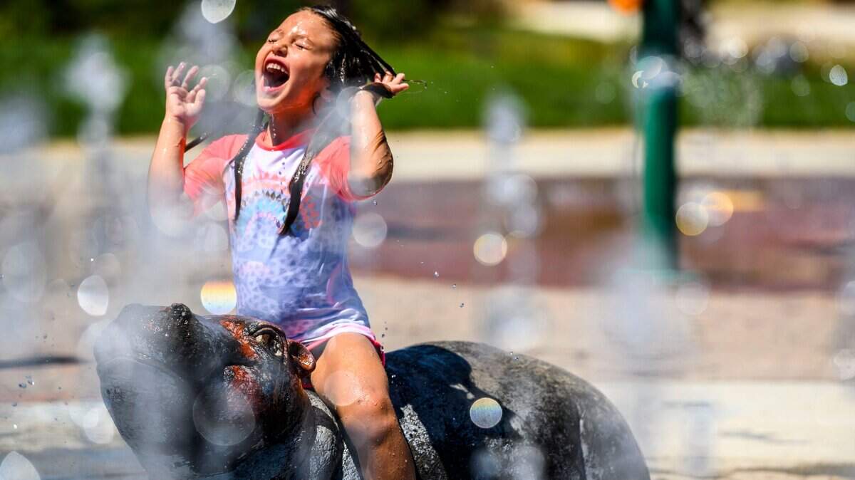 Myla Sigala, 4, a resident of Elk Grove, plays on a hippo shaped water feature at Derr-Okamoto Park in Elk Grove, Sunday, July 28, 2019.