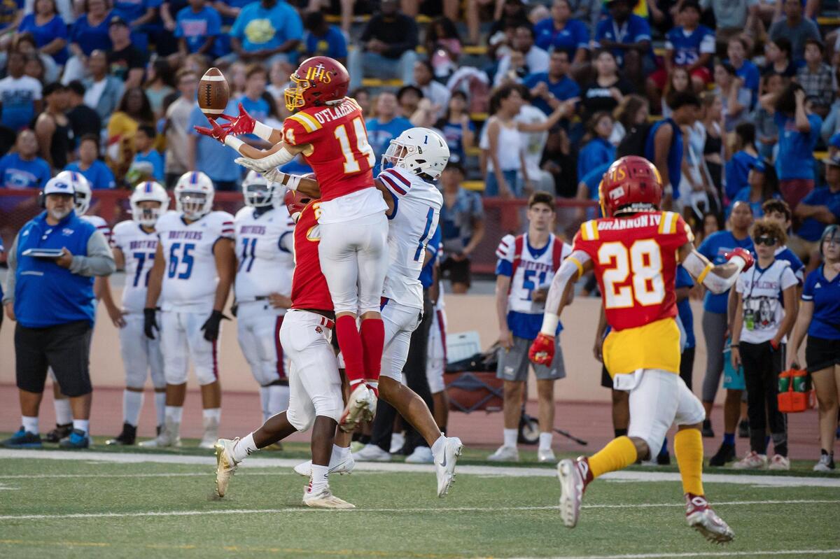 Jesuit’s Cormac O’Flaherty (14) defends a pass intended for Christian Brothers’ Phillip Bell (1) during the fourth quarter in the Holy Bowl on Saturday, Sept. 10, 2022, at Sacramento City College in Sacramento. The Marauders won 21-7.