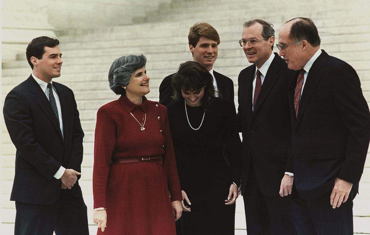 U.S. Supreme Court Chief Justice William Rehnquist, right, talks to soon-to-be-sworn-in Justice Anthony Kennedy, second from right, and his wife Mary and children on Feb. 18, 1988, on the steps of the Supreme court building in Washington, D.C.