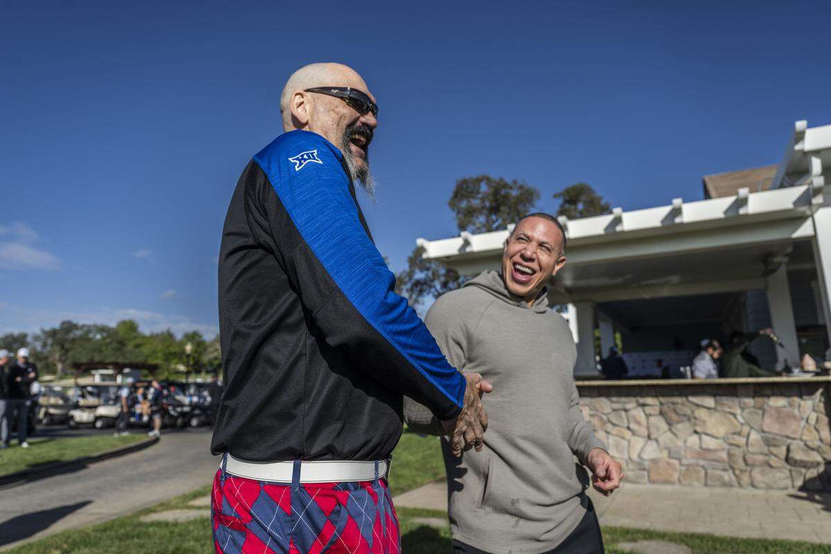 Former Sacramento Kings teammates Scot Pollard and Mike Bibby, the new coach of the Sacramento State men’s basketball team, visit during the Phil Oates Celebrity Golf Classic in Granite Bay on Monday.