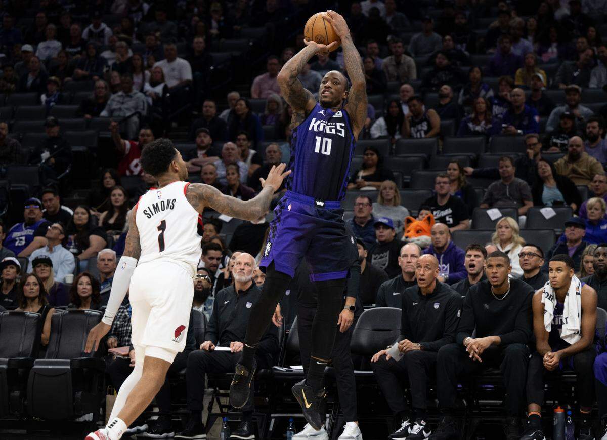 Sacramento Kings forward DeMar DeRozan (10) shoots and makes a buzzer beater at the end of the first half against Portland Trail Blazers guard Anfernee Simons (1) during an NBA game on Monday, Oct. 28, 2024 at Golden 1 Center. 