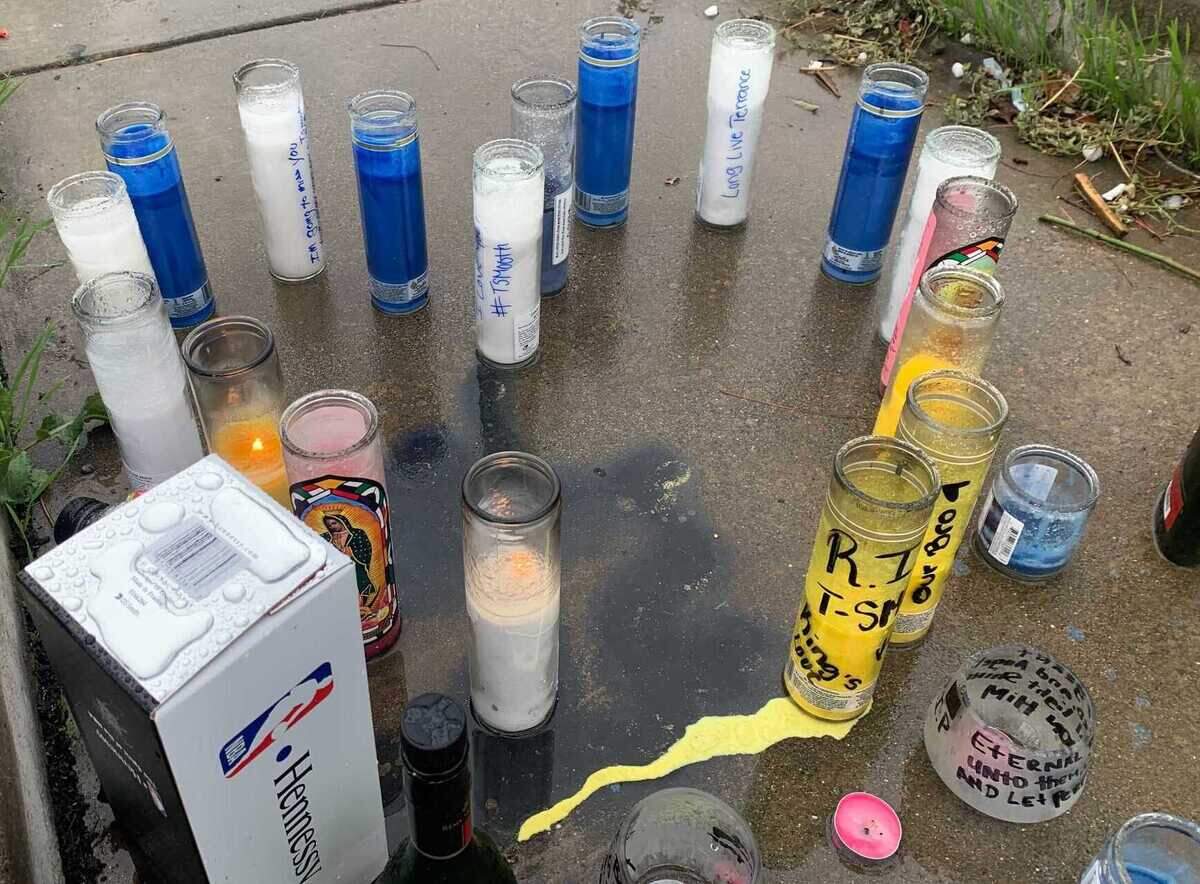 People created a makeshift memorial with candles, rose petals and other items outside the Royal Castle Banquet Hall, where two men were killed and fiver other people were injured in a shooting Saturday Oct. 30, 2021, during a large Halloween party in Sacramento County, California.