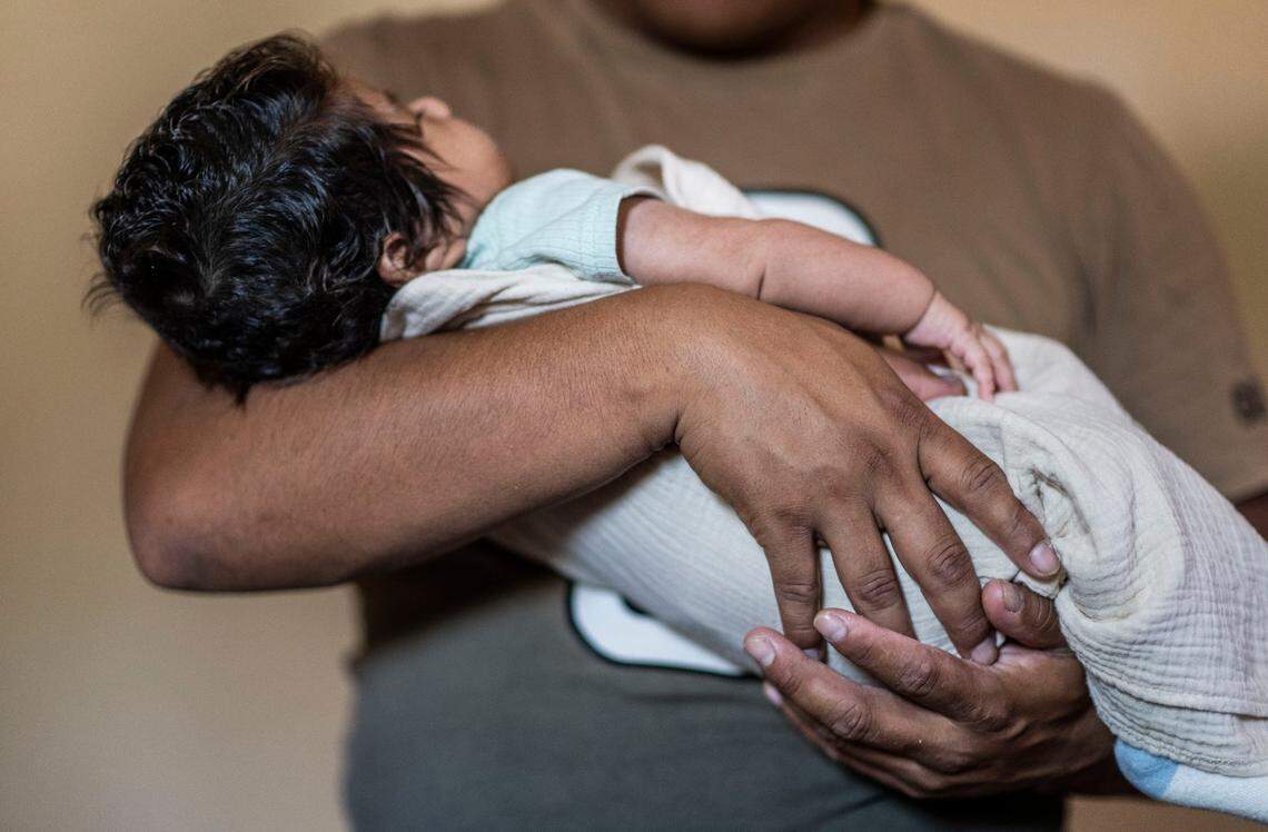A Sacramento father who has requested anonymity for fear of deportation and retaliation holds his son on Thursday. The baby, born locally a month ago, is the only member of the family who is a U.S. citizen – through the longstanding guarantee of birthright citizenship by the 14th Amendment, a right recently threatened by an executive order issued by President Donald Trump.
