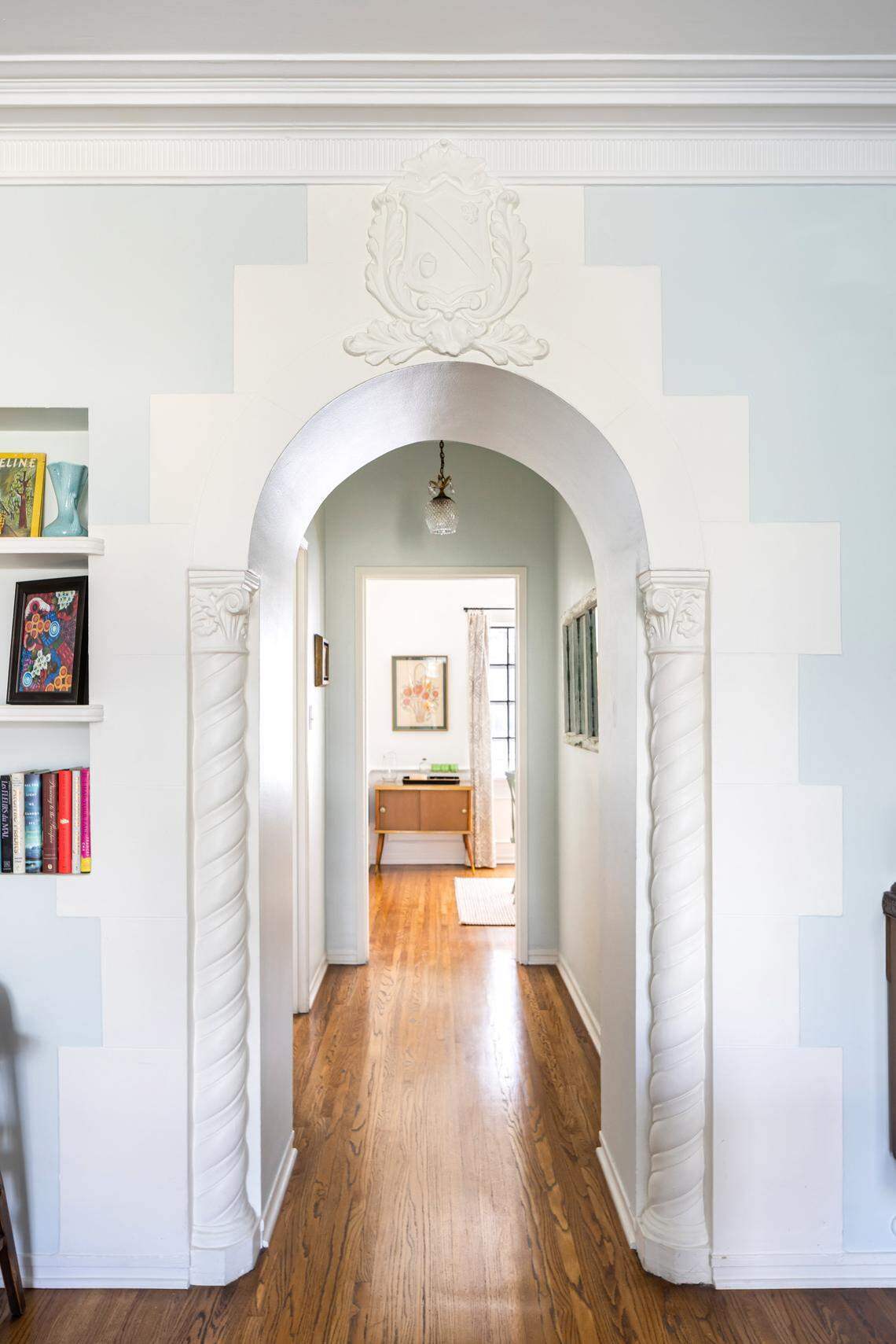 Period archways and crest moldings create a timeless atmosphere in this meticulously renovated one-bedroom unit.
