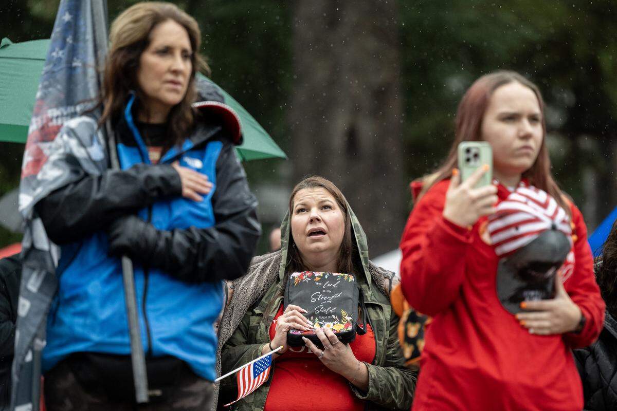 Charlie Kirk supporters recite the pledge allegiance  during a memorial event marking the birthday of conservative activist Charlie Kirk at the state Capitol on Tuesday.