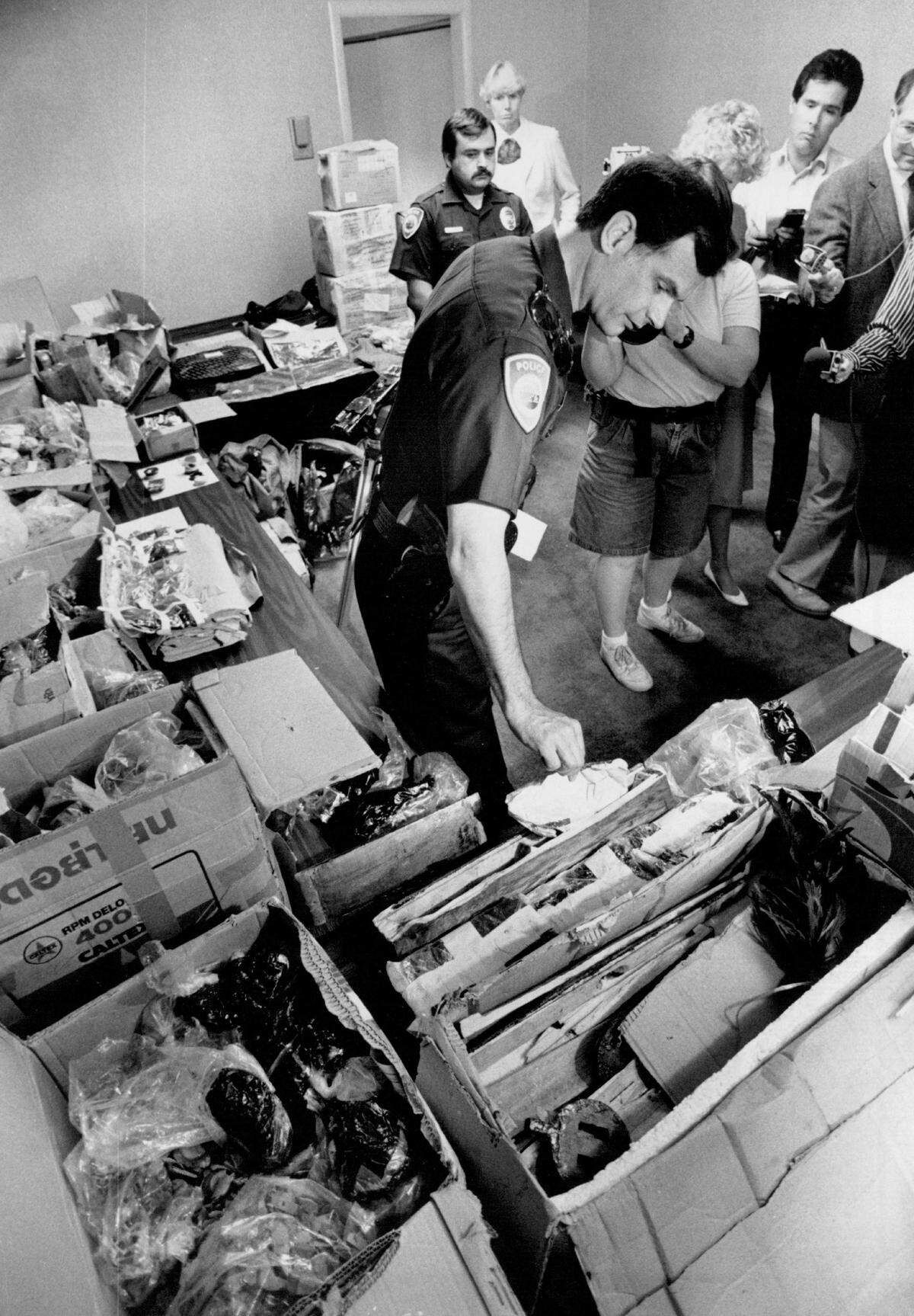 West Sacramento Police Chief Barry Kalar displays opium parcels seized from a city apartment complex in April 1988. Kalar died May 24 at age 79 after a battle with cancer, the department confirmed Tuesday.