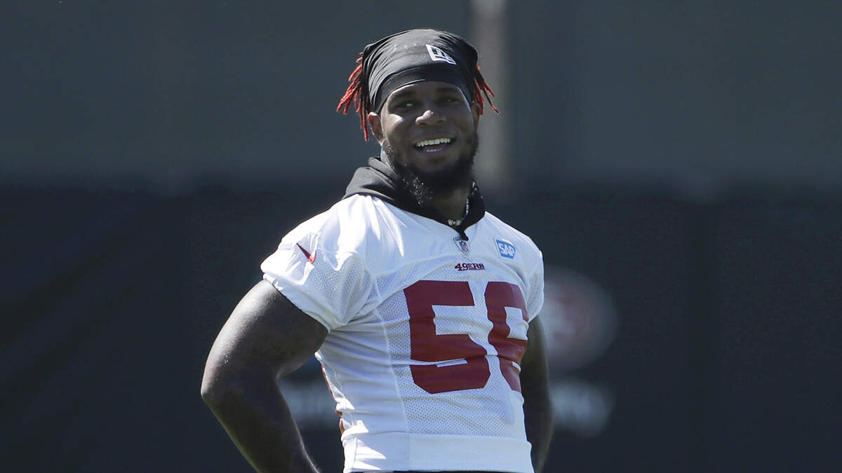 Linebacker Kwon Alexander, sporting red twists in his hair, enjoys a happy moment during San Francisco 49ers training camp Sunday in Santa Clara. Coming off an injury, Alexander said he felt “legendary” following his first two practices.