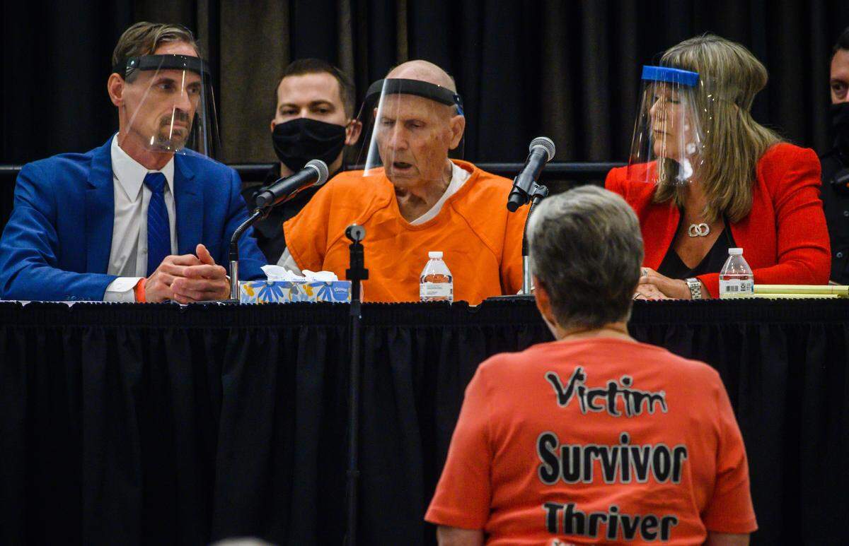 Jane Carson-Sandler, a victim of the East Area Rapist, approaches the defense table to confront Joseph James DeAngelo on June 29, 2020, while deputy district attorney Amy Holliday recounted Carson-Sandler’s case, and her description of DeAngelo as having a small penis. The moment drew cheers from the crowd. “I was hoping he would look at me,” she said afterward. “He didn’t, he just kept his head down.”