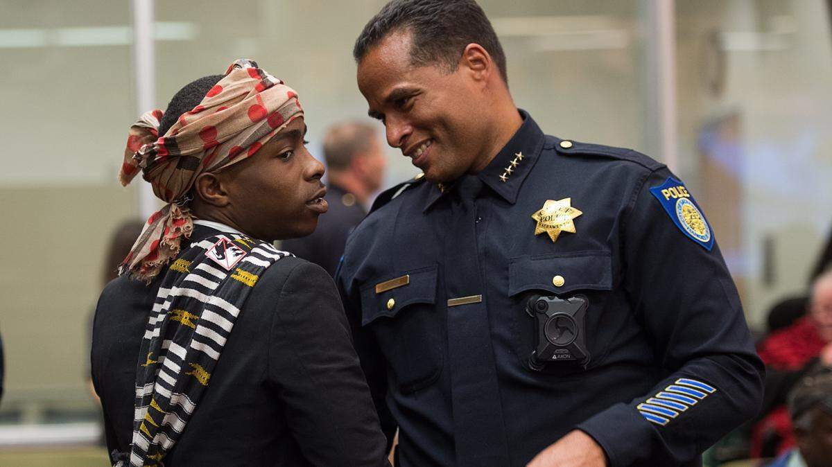 Stevante Clark, talks with Sacramento Police Chief Daniel Hahn before the city council meeting on Tuesday April 10, 2018 at City Hall in Sacramento. His brother, Stephon Clark, was unarmed when he was fatally shot by Sacramento Police in the backyard of his grandparents home.