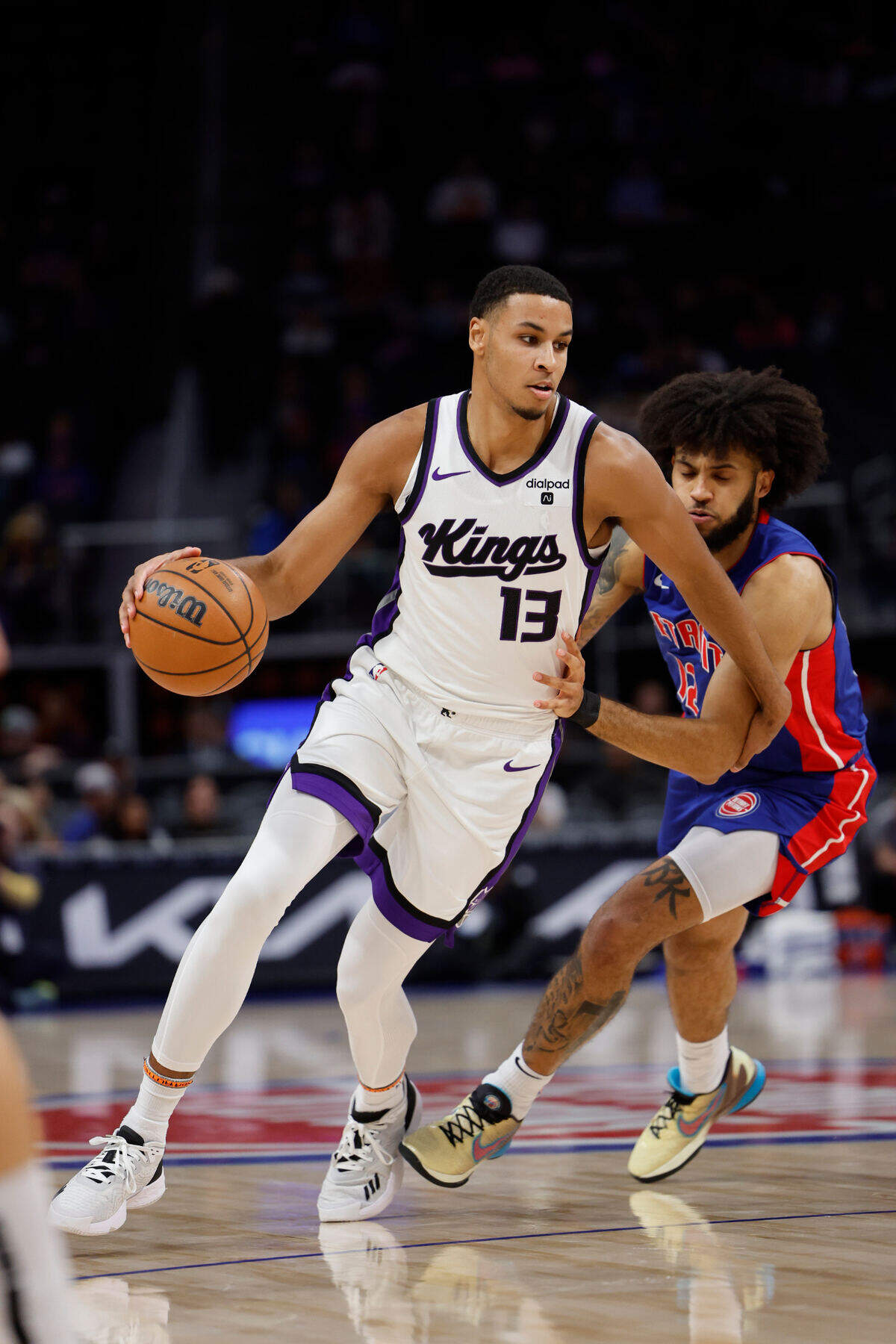 Sacramento Kings forward Keegan Murray (13) dribbles on Detroit Pistons forward Isaiah Livers on Tuesday at in Detroit.