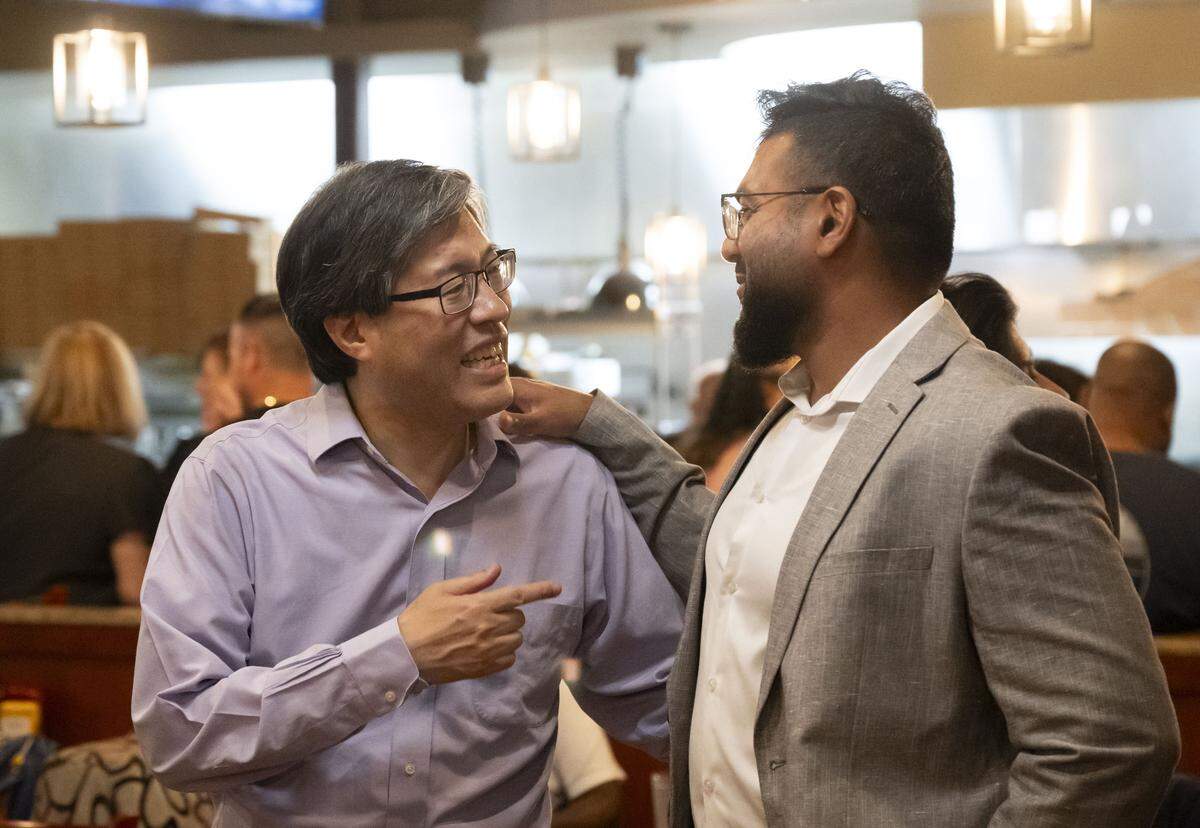 Former state Sen. Richard Pan, a candidate for the 6th Congressional District, speaks to former student and supporter Dr. Umer Waris during his election night party at Frends Brewhouse in South Natomas on Tuesday.