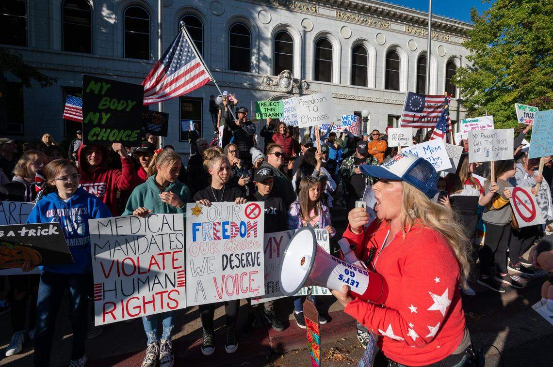 Placerville resident and organizer Mandi Rodriguez leads protesters during a rally against vaccine mandates at El Dorado County Courthouse in Placerville on Monday, Oct. 18, 2021.