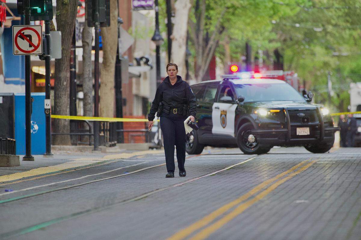 Sacramento Police Chief Kathy Lester walks the scene of the mass shooting in downtown Sacramento on Sunday, April 3, 2022.